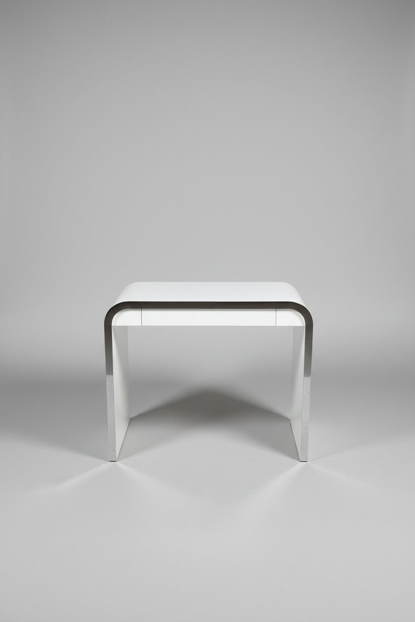 Laminate Waterfall Desk with chrome trim.