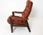 STYLE OF EKORNES LEATHER LOUNGE CHAIR C. 1970S
